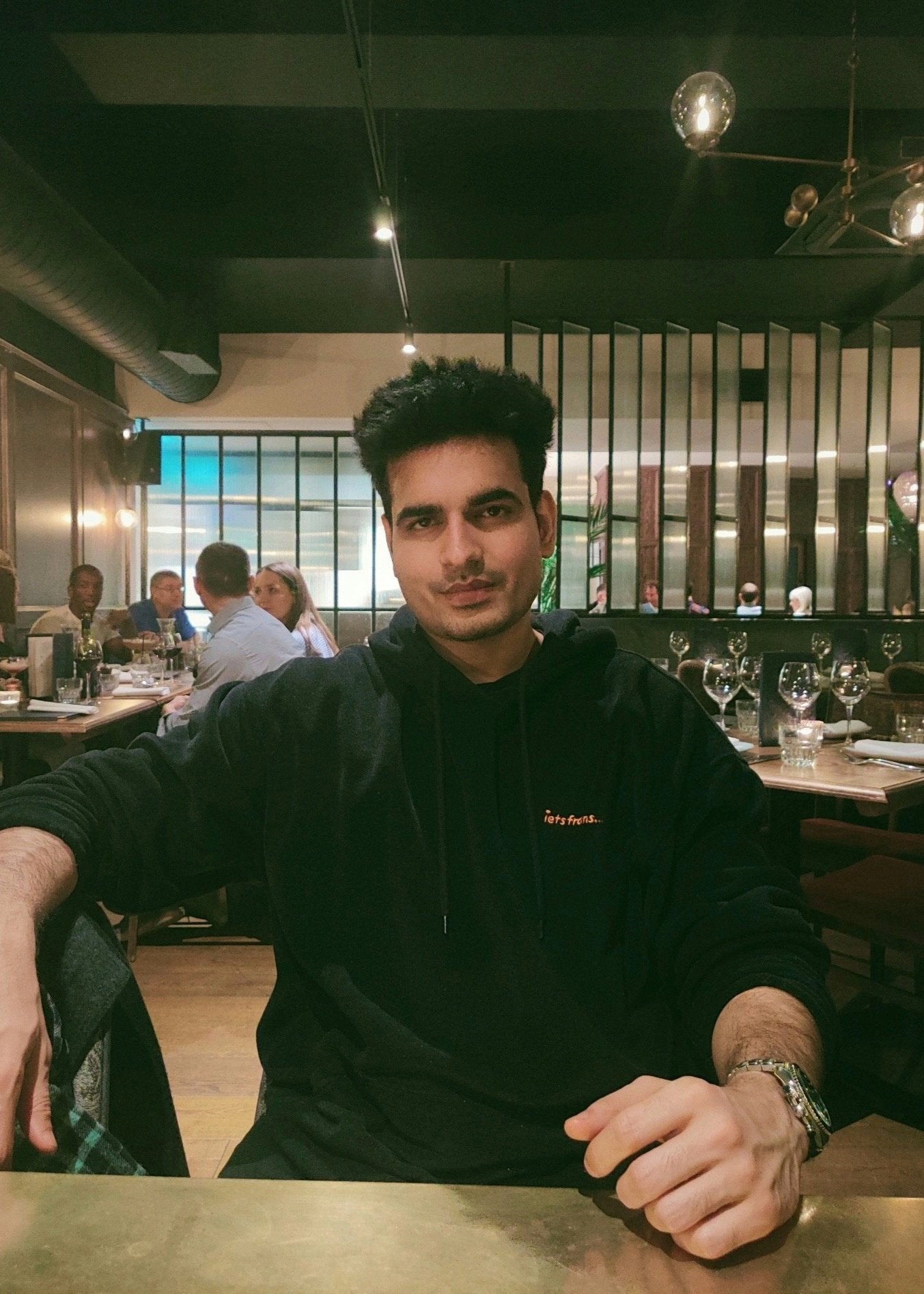 Man sitting in cafe smiling