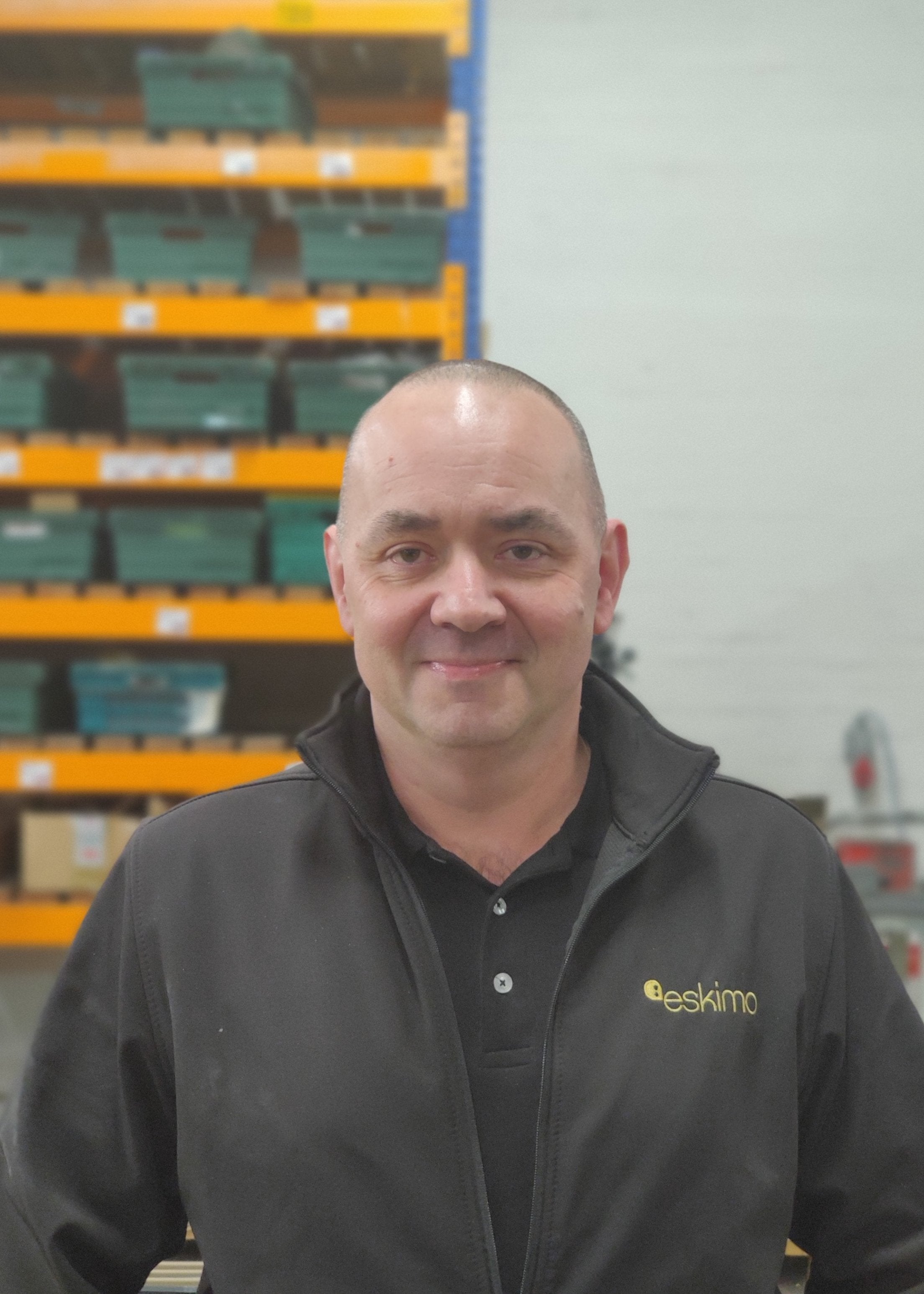 Man smiling in warehouse